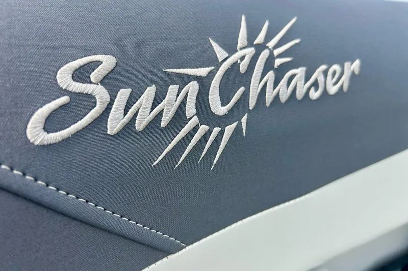 Slide: The Image of Sun Chaser Geneva 2023 logo embroidered on gray fabric seat. - 29