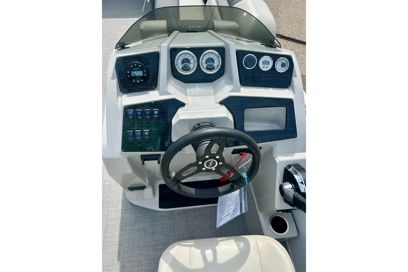 Slide: The Image of 2023 Sun Chaser Geneva boat dashboard with steering wheel and control panel. - 33