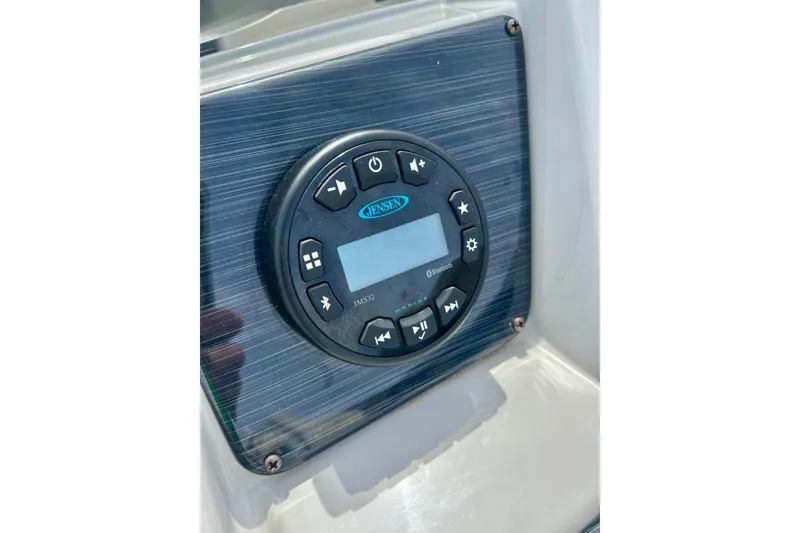 Slide: The Image of 2023 Sun Chaser Geneva boat stereo system with control panel and display. - 34