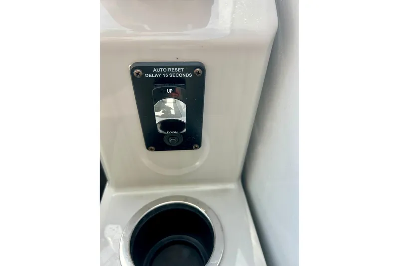 Slide: The Image of Control panel with auto reset switch in 2023 Sun Chaser Geneva boat. - 39