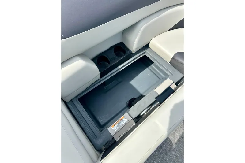 Slide: The Image of Sun Chaser Geneva 2023 boat seat storage compartment with cup holders. - 42