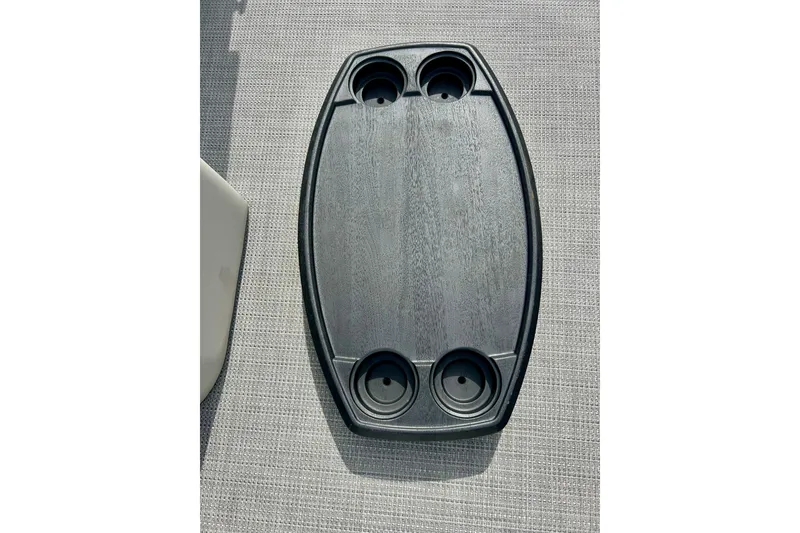 Slide: The Image of Oval table with cup holders on a Sun Chaser Geneva 2023 boat. - 47