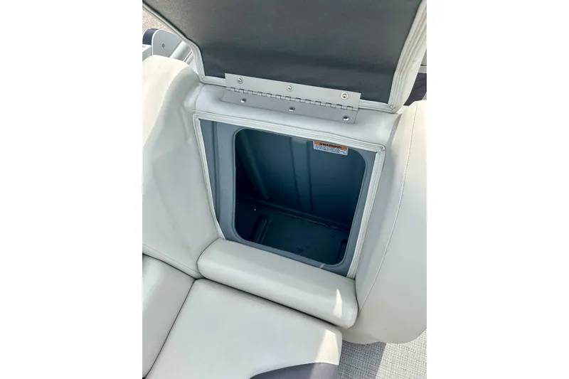 Slide: The Image of 2023 Sun Chaser Geneva boat seat storage compartment, open and empty. - 49
