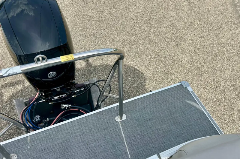 Slide: The Image of 2023 Sun Chaser Geneva boat with outboard motor and deck railing, top view. - 54
