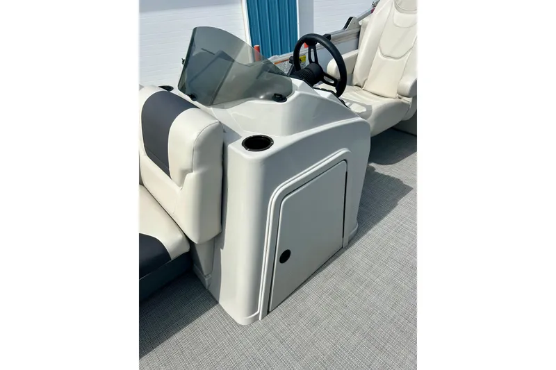 Slide: The Image of 2023 Sun Chaser Geneva boat console with steering wheel and seating. - 56