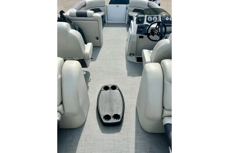 Slide: The Image of 2023 Sun Chaser Geneva boat interior with plush seating and modern dashboard. - 59