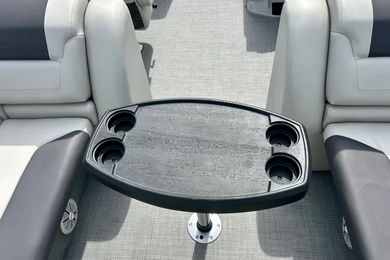 Slide: The Image of Luxury seating and table with cup holders on 2023 Sun Chaser Geneva boat. - 63