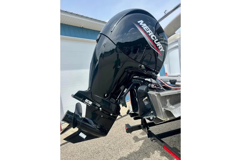 Slide: The Image of Outboard motor on a 2023 Sun Chaser Geneva boat, featuring a sleek Mercury engine. - 8