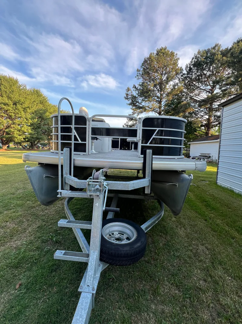 Slide: The Image of 2020 Godfrey Sweetwater 208 pontoon boat on trailer outdoors. - 1