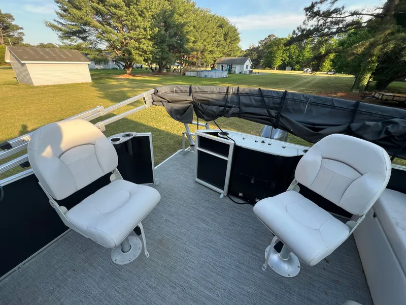 Slide: The Image of Interior of a 2020 Godfrey Sweetwater 208 pontoon boat with two white seats. - 11