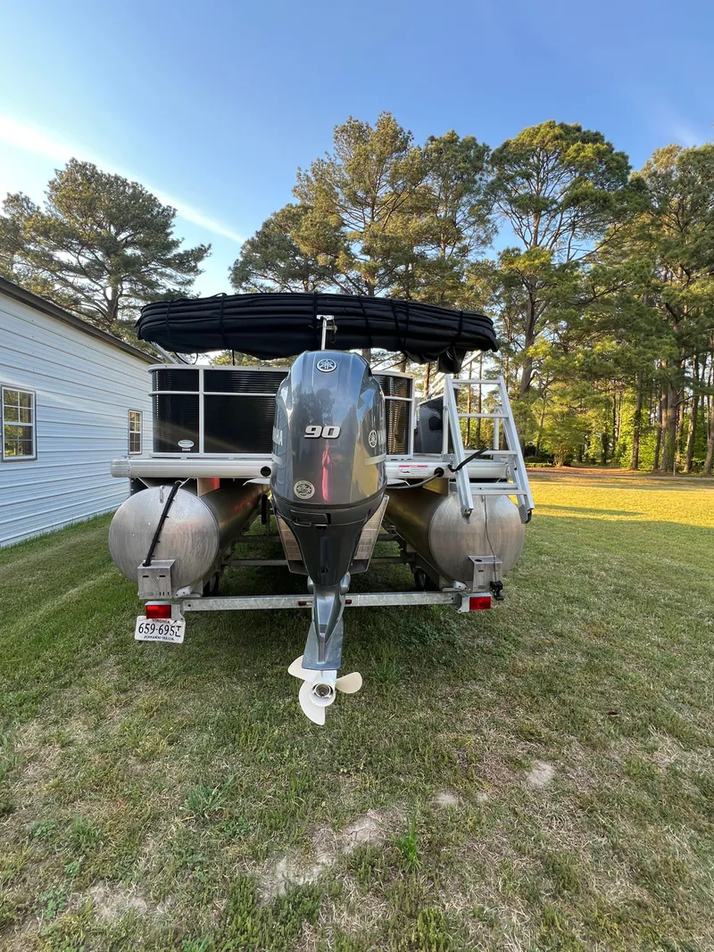 Slide: The Image of Rear view of a 2020 Godfrey Sweetwater 208 pontoon boat outdoors. - 2