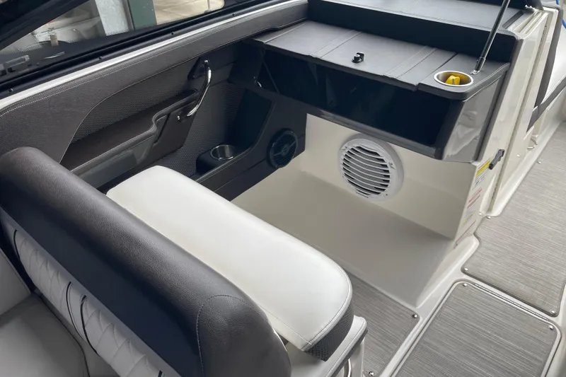 Slide: The Image of Interior of a 2016 Sea Ray SLX 230 boat, featuring seating and speaker system. - 11