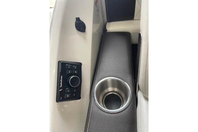 Slide: The Image of 2016 Sea Ray SLX 230 interior with Rockford Fosgate controls and cup holder. - 20