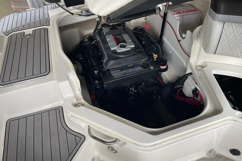 Slide: The Image of Engine compartment of a 2016 Sea Ray SLX 230 boat, showcasing the engine and interior details. - 22