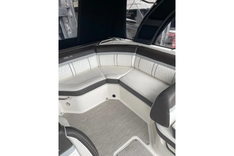 Slide: The Image of Interior seating of 2016 Sea Ray SLX 230 boat, featuring elegant upholstery and spacious design. - 26