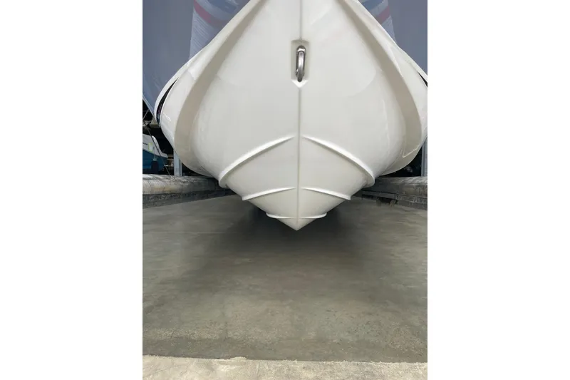 Slide: The Image of 2016 Sea Ray SLX 230 boat hull in storage, showcasing sleek design and craftsmanship. - 3