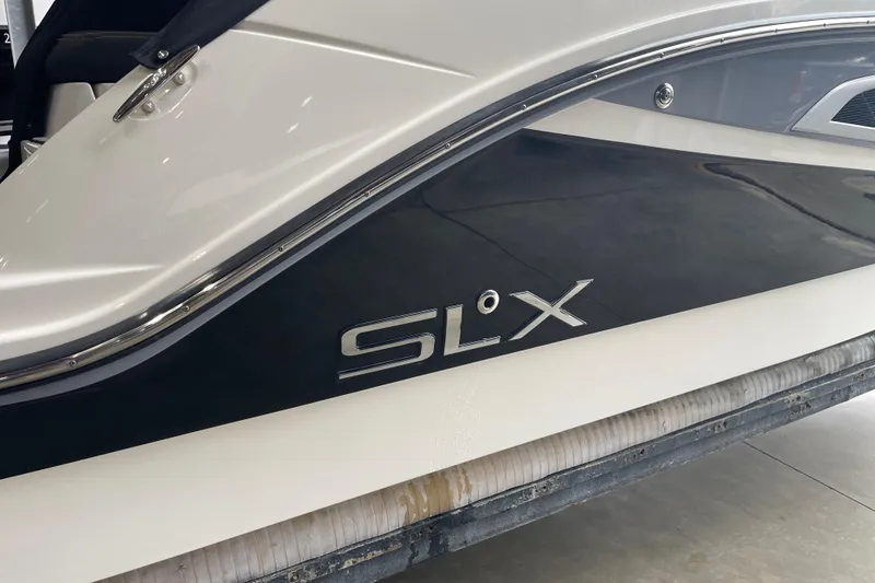 Slide: The Image of 2016 Sea Ray SLX 230 boat side view with logo detail. - 8