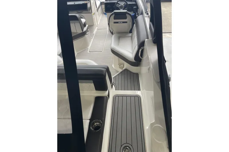Slide: The Image of 2016 Sea Ray SLX 230 boat interior with sleek seating and modern design. - 9