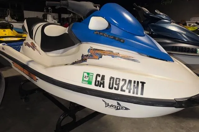 The Image of 2004 Sea-Doo GTI RFI jet ski with registration GA 0924HT in a showroom. - 1