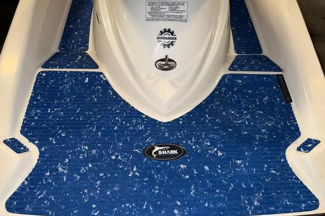 Slide: The Image of 2004 Sea-Doo GTI RFI with blue Shark traction mats and Bombardier logo. - 11