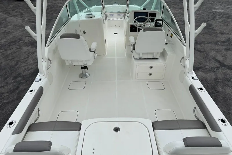 Slide: The Image of 2020 World Cat 230 DC boat interior with seating and steering console. - 16