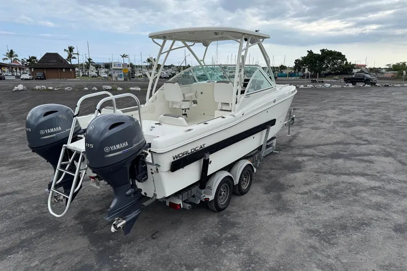 Slide: The Image of 2020 World Cat 230 DC boat with twin Yamaha engines on a trailer. - 5