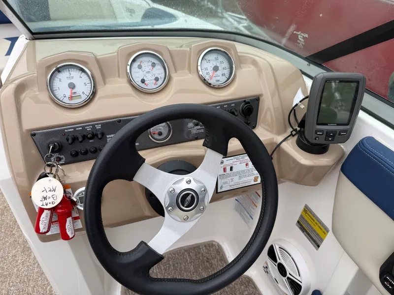 Slide: The Image of Dashboard of a 2014 Chaparral 210 boat. - 6