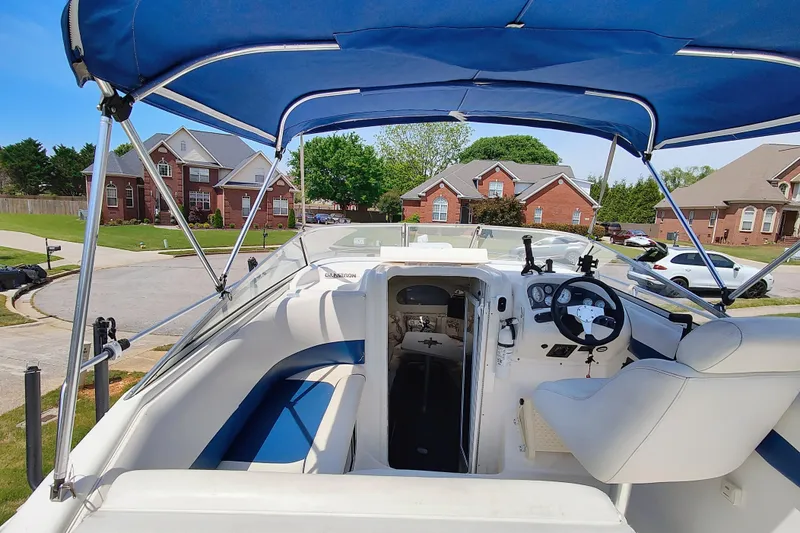 Slide: The Image of 2001 Glastron GS 249 boat interior with blue and white seating. - 13