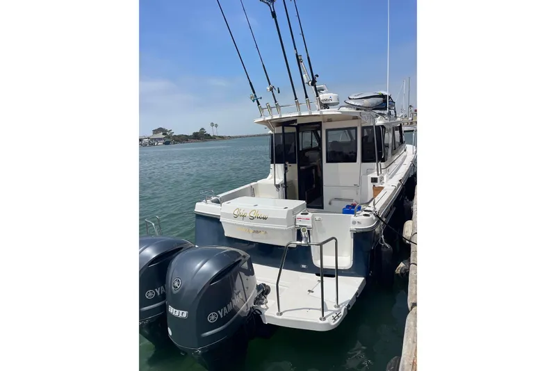 The Image of 2019 Cutwater C-302 Coupe boat being lifted at a marina. - 0