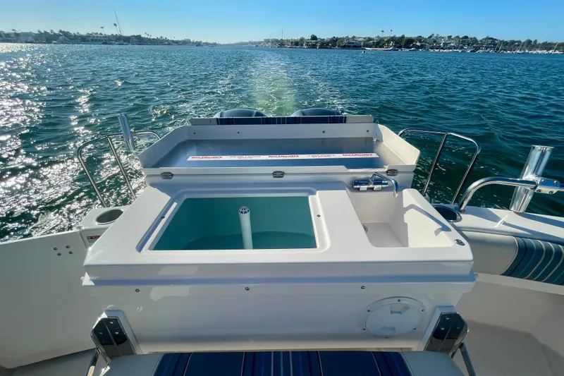 Slide: The Image of 2019 Cutwater C-302 Coupe boat with open water view and onboard amenities. - 11