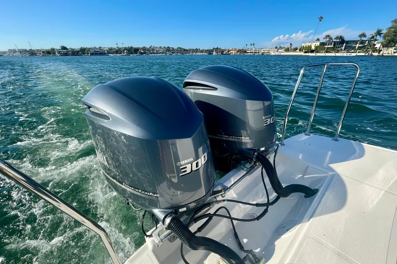Slide: The Image of 2019 Cutwater C-302 Coupe with twin Yamaha 300 engines on a sunny day. - 12