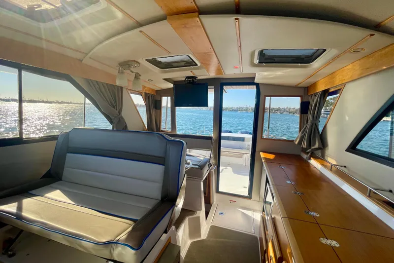 Slide: The Image of Interior of 2019 Cutwater C-302 Coupe boat with scenic water view. - 21