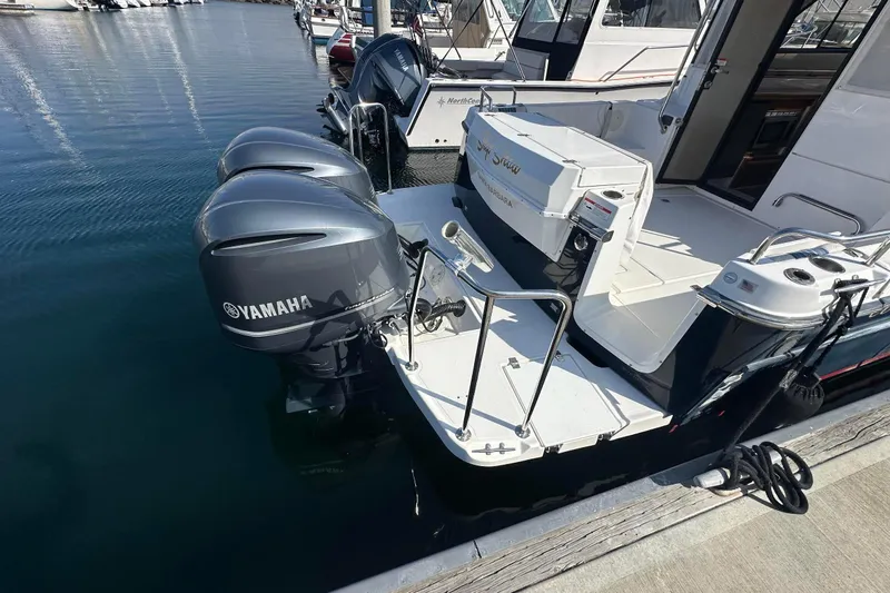Slide: The Image of 2019 Cutwater C-302 Coupe with dual Yamaha outboard engines docked at marina. - 5