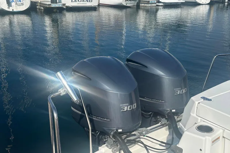 Slide: The Image of Twin Yamaha 300 outboard engines on a 2019 Cutwater C-302 Coupe, docked in a marina. - 6