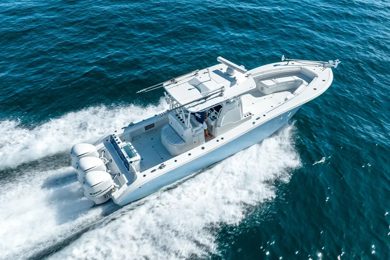 Slide: The Image of 2020 Yellowfin 36 Offshore boat cruising on open sea. - 10