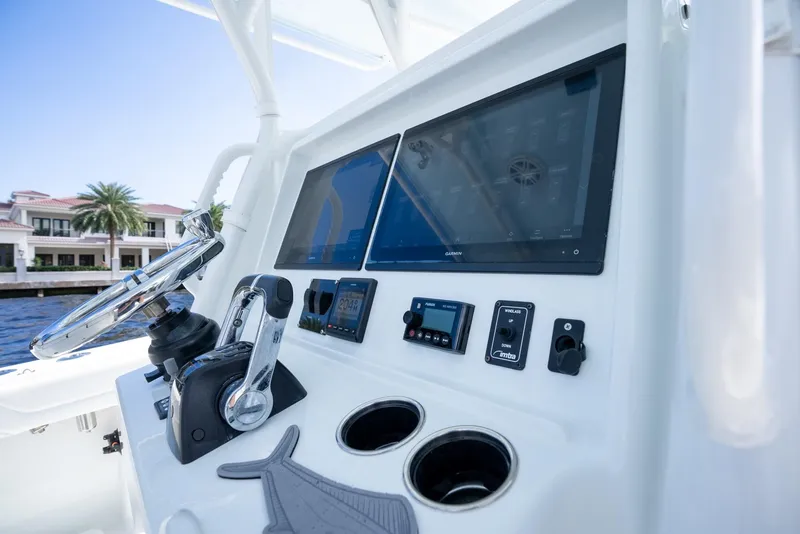 Slide: The Image of 2020 Yellowfin 36 Offshore helm with modern navigation instruments. - 19