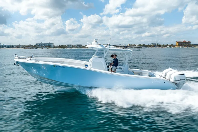 Slide: The Image of 2020 Yellowfin 36 Offshore boat cruising on water. - 2