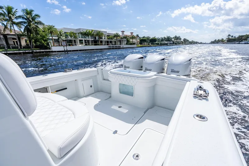 Slide: The Image of 2020 Yellowfin 36 Offshore boat on water with three engines. - 22