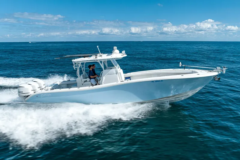 Slide: The Image of 2020 Yellowfin 36 Offshore boat cruising on open sea. - 4