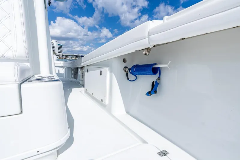 Slide: The Image of 2020 Yellowfin 36 Offshore boat deck with blue hose. - 41