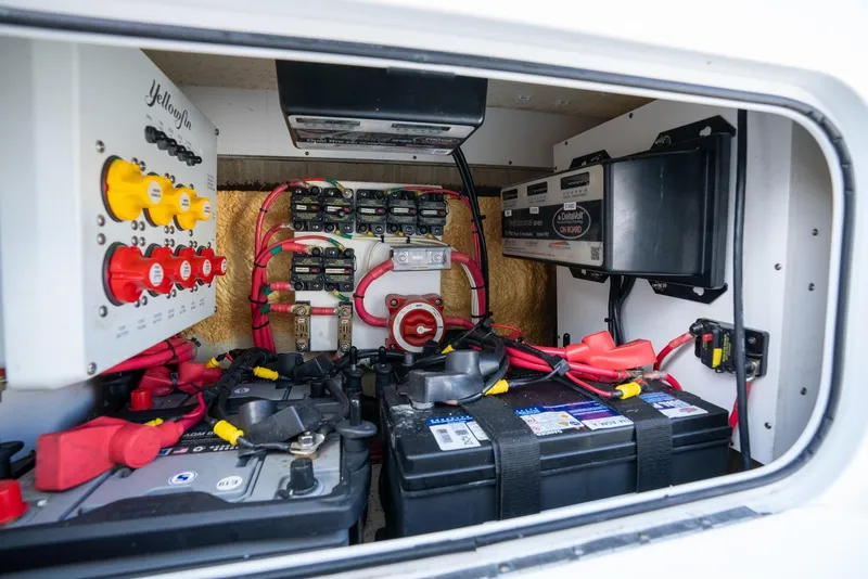 Slide: The Image of 2020 Yellowfin 36 Offshore electrical system with batteries and wiring. - 43