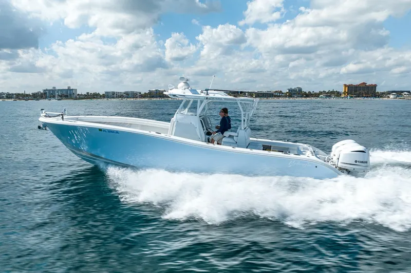 Slide: The Image of 2020 Yellowfin 36 Offshore boat cruising on the sea under sunny skies. - 7