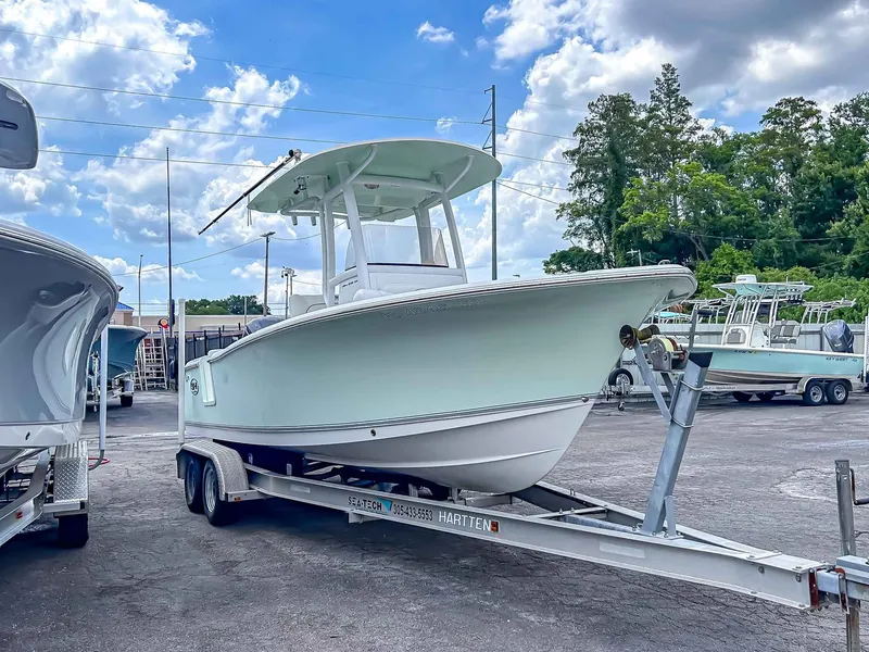 Slide: The Image of 2014 Sea Hunt Ultra 235 boat on trailer outdoors. - 3