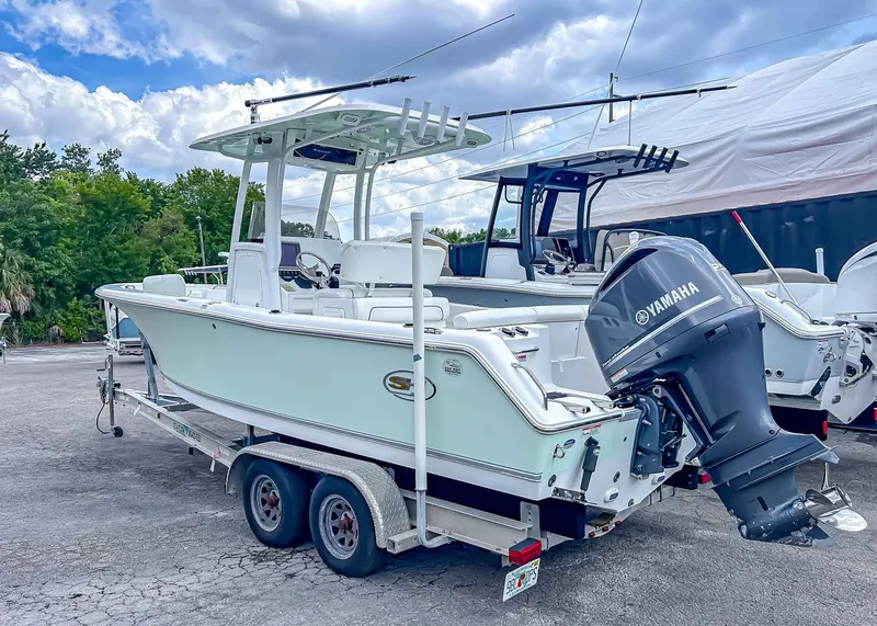 Slide: The Image of 2014 Sea Hunt Ultra 235 boat on trailer with Yamaha engine. - 4