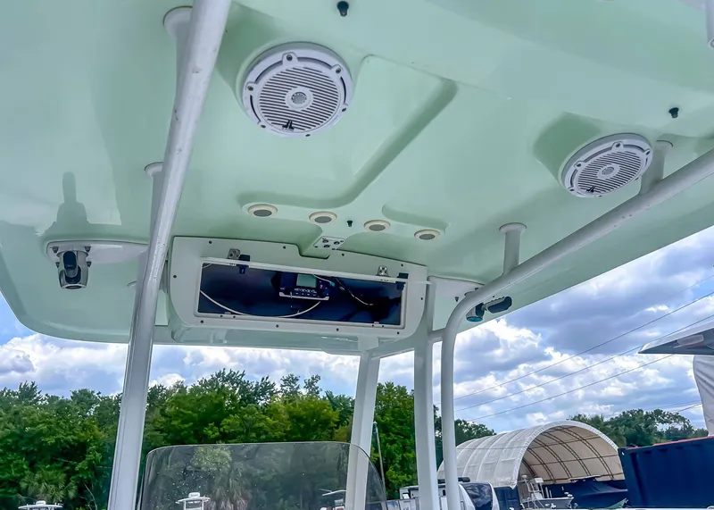 Slide: The Image of Interior view of a 2014 Sea Hunt Ultra 235 boat with speakers. - 9