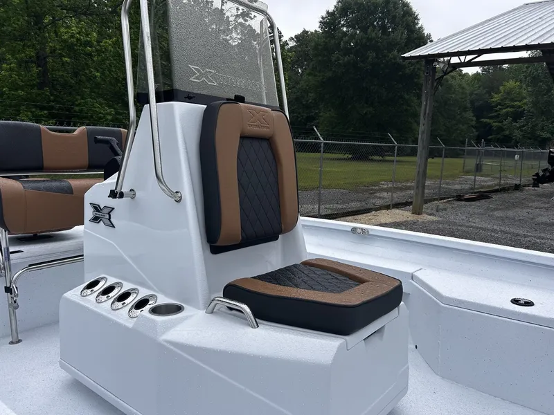 Slide: The Image of 2026 Xpress H20B Bay boat with cushioned seat and helm console. - 6
