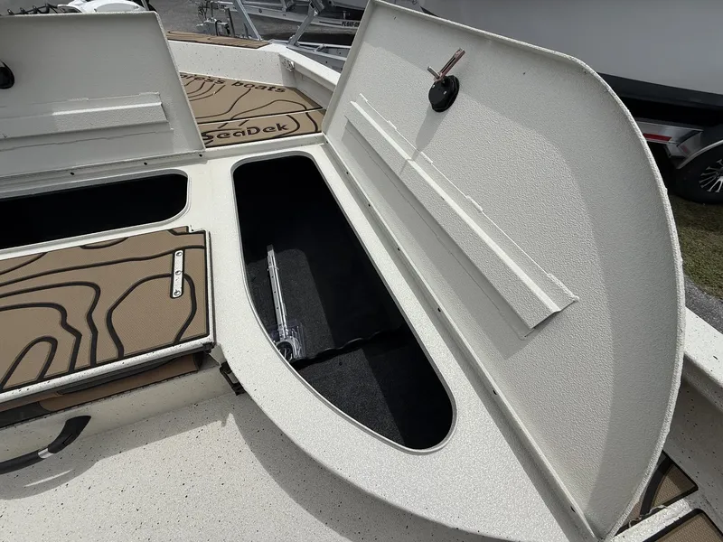 Slide: The Image of Xpress X23B Bay Lounge 2026 with open storage compartment lid. - 10