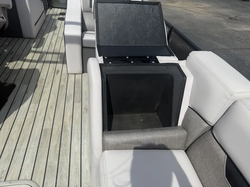 Slide: The Image of Interior of a 2017 Crest Caliber 250 SLR2 boat with storage compartment. - 12