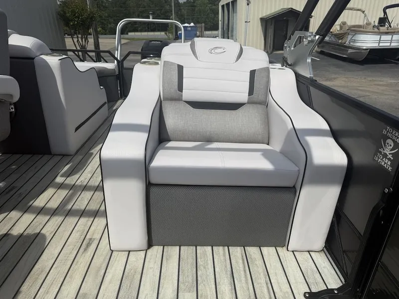 Slide: The Image of 2017 Crest Caliber 250 SLR2 boat seat on wooden deck. - 13