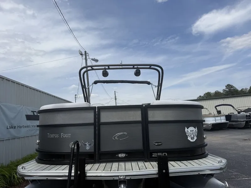 Slide: The Image of 2017 Crest Caliber 250 SLR2 pontoon boat parked outdoors. - 4